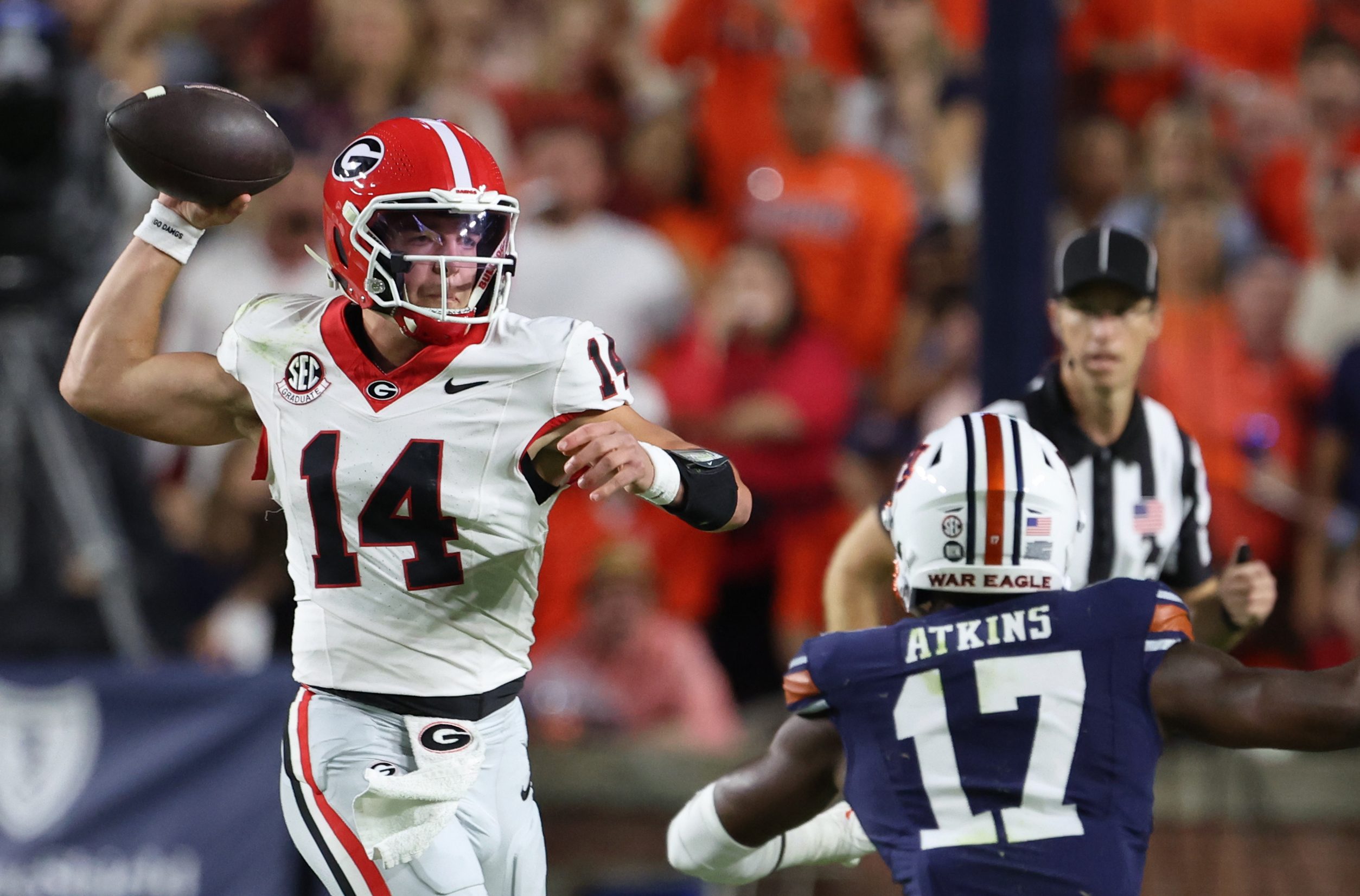 Oct 11, 2025; Auburn, Alabama, USA;  Georgia Bulldogs quarterback Gunner Stockton (14) looks for a receiver during the first quarter against the Auburn Tigers at Jordan-Hare Stadium. Mandatory Credit: John Reed-Imagn Images