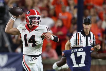 Oct 11, 2025; Auburn, Alabama, USA;  Georgia Bulldogs quarterback Gunner Stockton (14) looks for a receiver during the first quarter against the Auburn Tigers at Jordan-Hare Stadium. Mandatory Credit: John Reed-Imagn Images