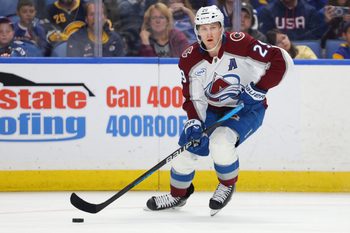 Oct 13, 2025; Buffalo, New York, USA;  Colorado Avalanche center Nathan MacKinnon (29) looks to make a pass during the third period against the Buffalo Sabres at KeyBank Center. Mandatory Credit: Timothy T. Ludwig-Imagn Images