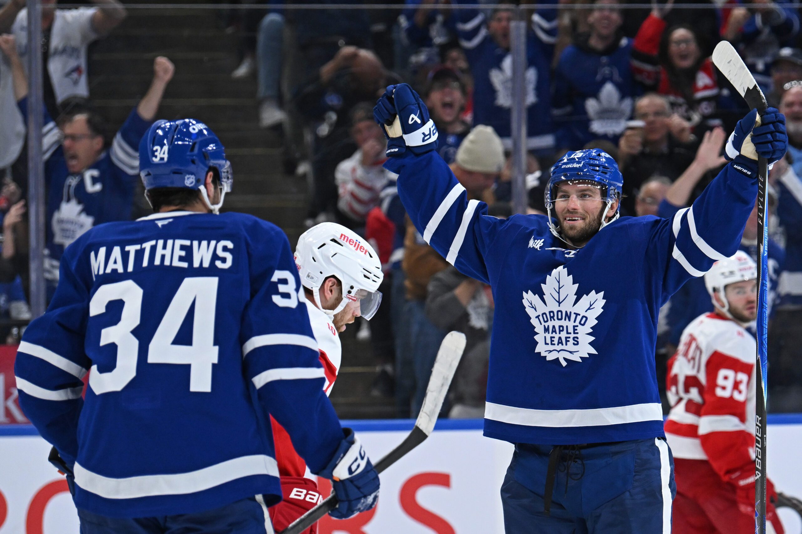 Oct 13, 2025; Toronto, Ontario, CAN; Toronto Maple Leafs right wing Calle Jarnkrok (19) celebrates a goal with center Auston Matthews (34) in the third period at Scotiabank Arena. Mandatory Credit: Gerry Angus-Imagn Images