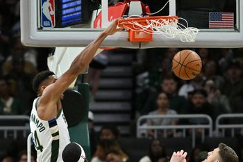 Oct 14, 2025; Milwaukee, Wisconsin, USA; Milwaukee Bucks forward Giannis Antetokounmpo (34) dunks against the Oklahoma City Thunder during the second half at Fiserv Forum. Mandatory Credit: Patrick Gorski-Imagn Images
