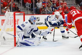 Oct 17, 2025; Detroit, Michigan, USA; Tampa Bay Lightning goaltender Andrei Vasilevskiy (88) blocks a shot by Detroit Red Wings left wing James van Riemsdyk (21) during the second period at Little Caesars Arena. Mandatory Credit: Brian Bradshaw Sevald-Imagn Images