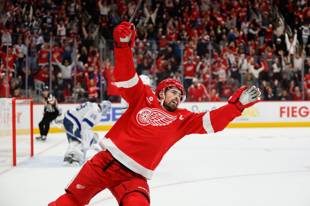 Oct 17, 2025; Detroit, Michigan, USA; Detroit Red Wings center Dylan Larkin (71) scores the game winning goal in overtime against Tampa Bay Lightning goaltender Andrei Vasilevskiy (88) at Little Caesars Arena. Mandatory Credit: Brian Bradshaw Sevald-Imagn Images