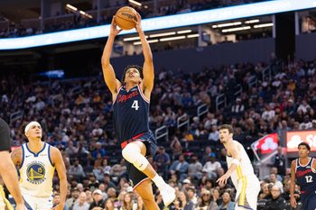 Oct 17, 2025; San Francisco, California, USA; Los Angeles Clippers guard Kobe Sanders (4) dunks the ball ahead of Golden State Warriors forward Gui Santos (15) during the third quarter at Chase Center. Mandatory Credit: D. Ross Cameron-Imagn Images