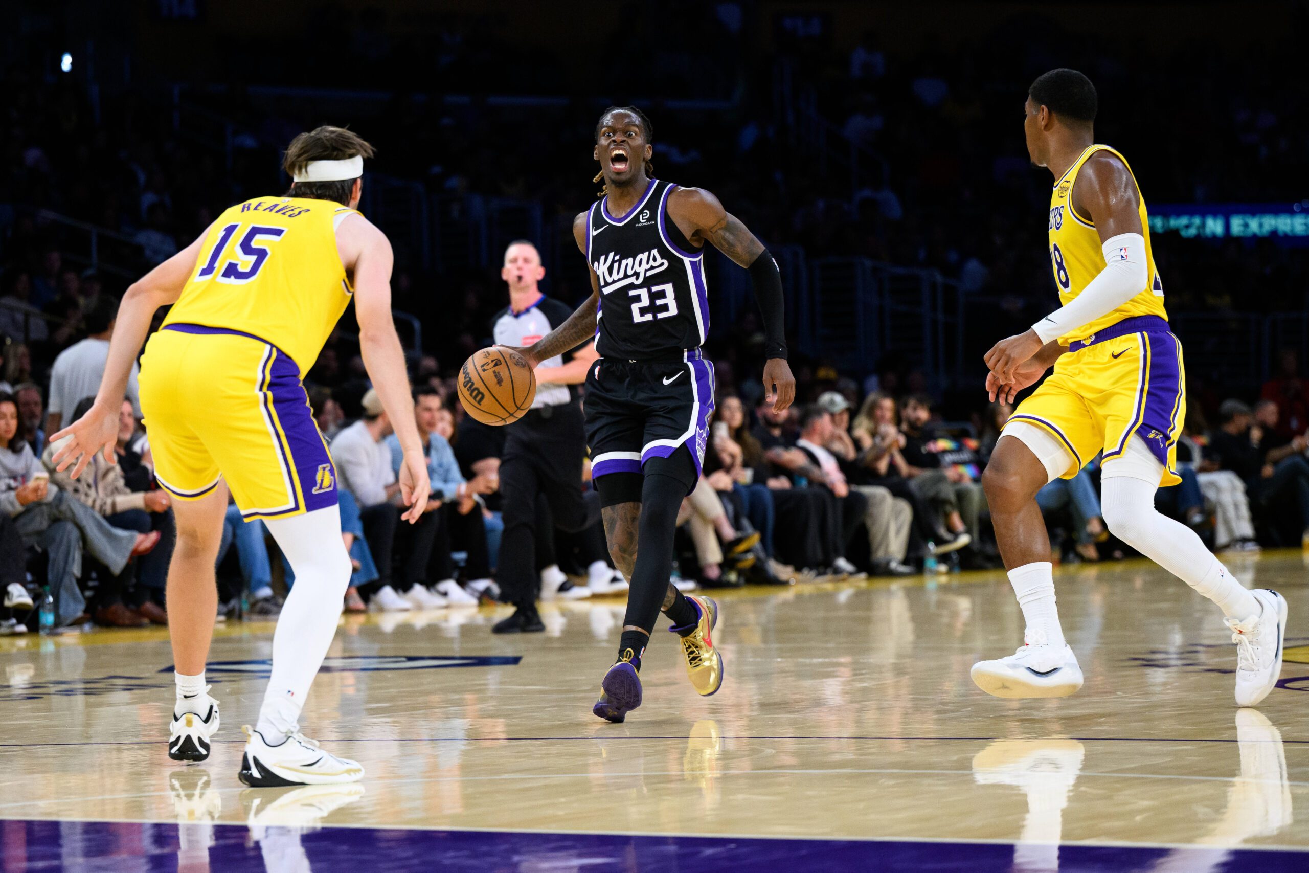 Oct 17, 2025; Los Angeles, California, USA; Sacramento Kings guard Keon Ellis (23) yells down the court during the first half against the Los Angeles Lakers at Crypto.com Arena. Mandatory Credit: William Liang-Imagn Images