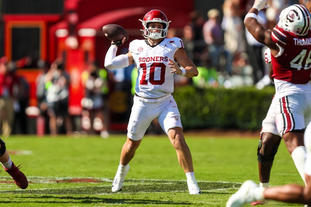 Oct 18, 2025; Columbia, South Carolina, USA; Oklahoma Sooners quarterback John Mateer (10) passes against the South Carolina Gamecocks in the second half at Williams-Brice Stadium. Mandatory Credit: Jeff Blake-Imagn Images