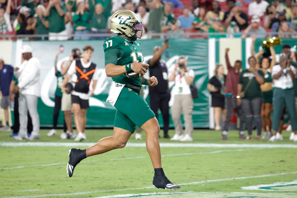 Oct 18, 2025; Tampa, Florida, USA; South Florida Bulls quarterback Byrum Brown (17) runs for a touchdown during the first quarter against the Florida Atlantic Owls at Raymond James Stadium. Mandatory Credit: Reinhold Matay-Imagn Images