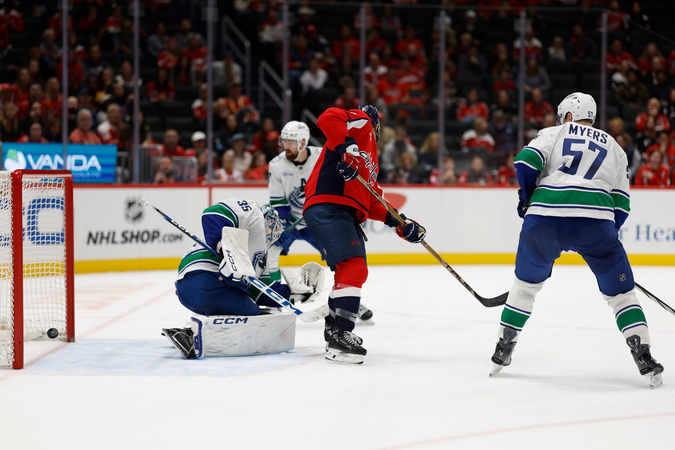 Oct 19, 2025; Washington, District of Columbia, USA; Vancouver Canucks goaltender Thatcher Demko (35) is beaten by a shot from Washington Capitals defenseman John Carlson (not pictured) during the third period at Capital One Arena. Mandatory Credit: Geoff Burke-Imagn Images