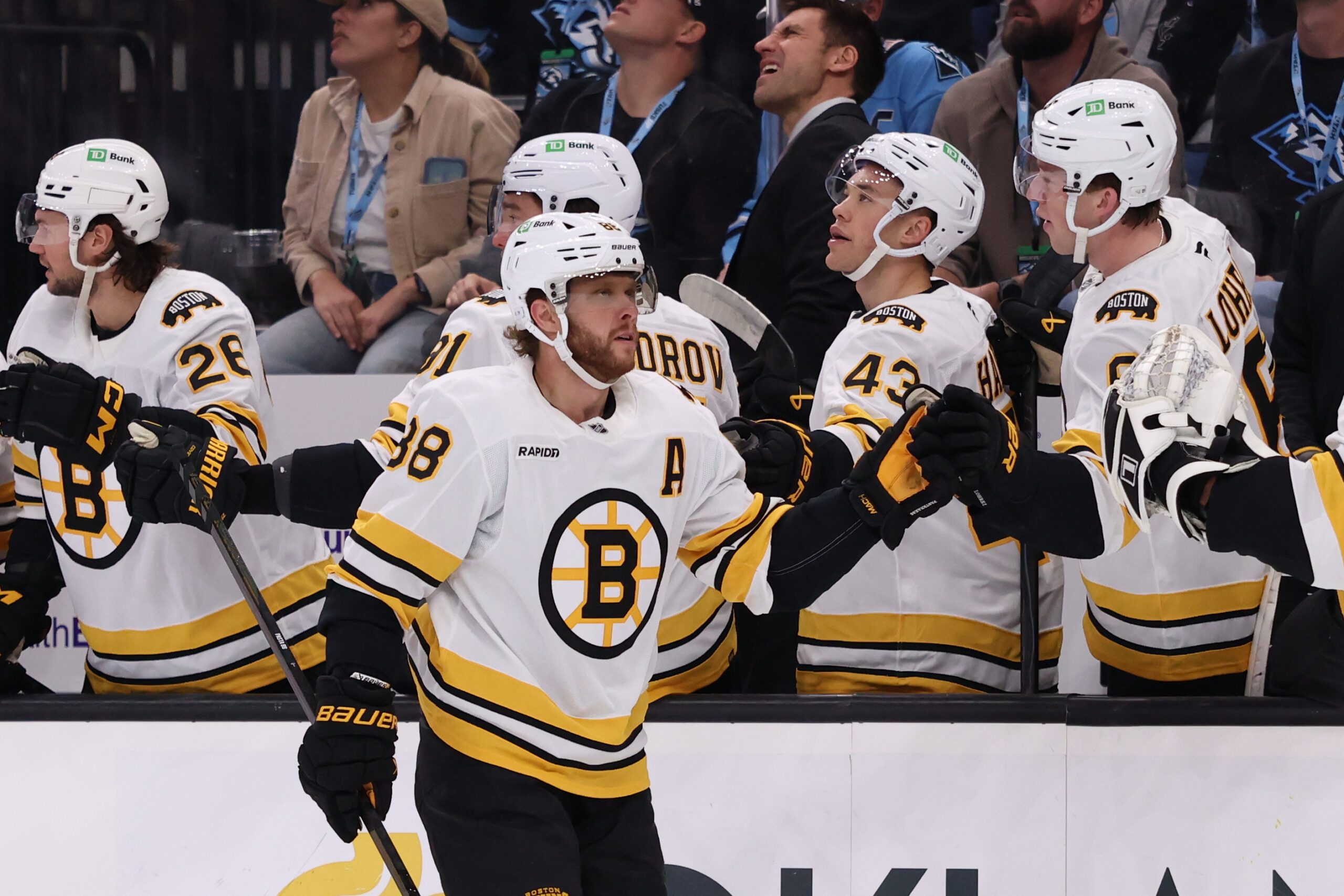 Oct 19, 2025; Salt Lake City, Utah, USA; Boston Bruins right wing David Pastrnak (88) scores a goal against the Utah Mammoth and celebrates with teammates during the first period at Delta Center. Mandatory Credit: Rob Gray-Imagn Images