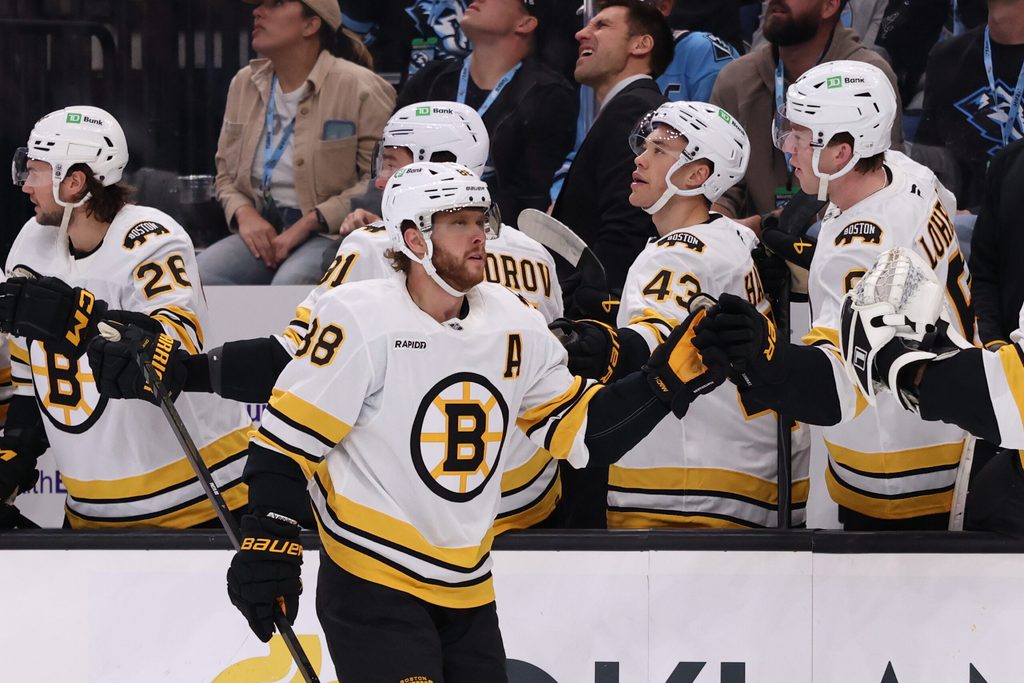 Oct 19, 2025; Salt Lake City, Utah, USA; Boston Bruins right wing David Pastrnak (88) scores a goal against the Utah Mammoth and celebrates with teammates during the first period at Delta Center. Mandatory Credit: Rob Gray-Imagn Images