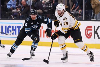 Oct 19, 2025; Salt Lake City, Utah, USA; Boston Bruins center Pavel Zacha (18) skates with the puck against Utah Mammoth left wing Lawson Crouse (67) during the second period at Delta Center. Mandatory Credit: Rob Gray-Imagn Images