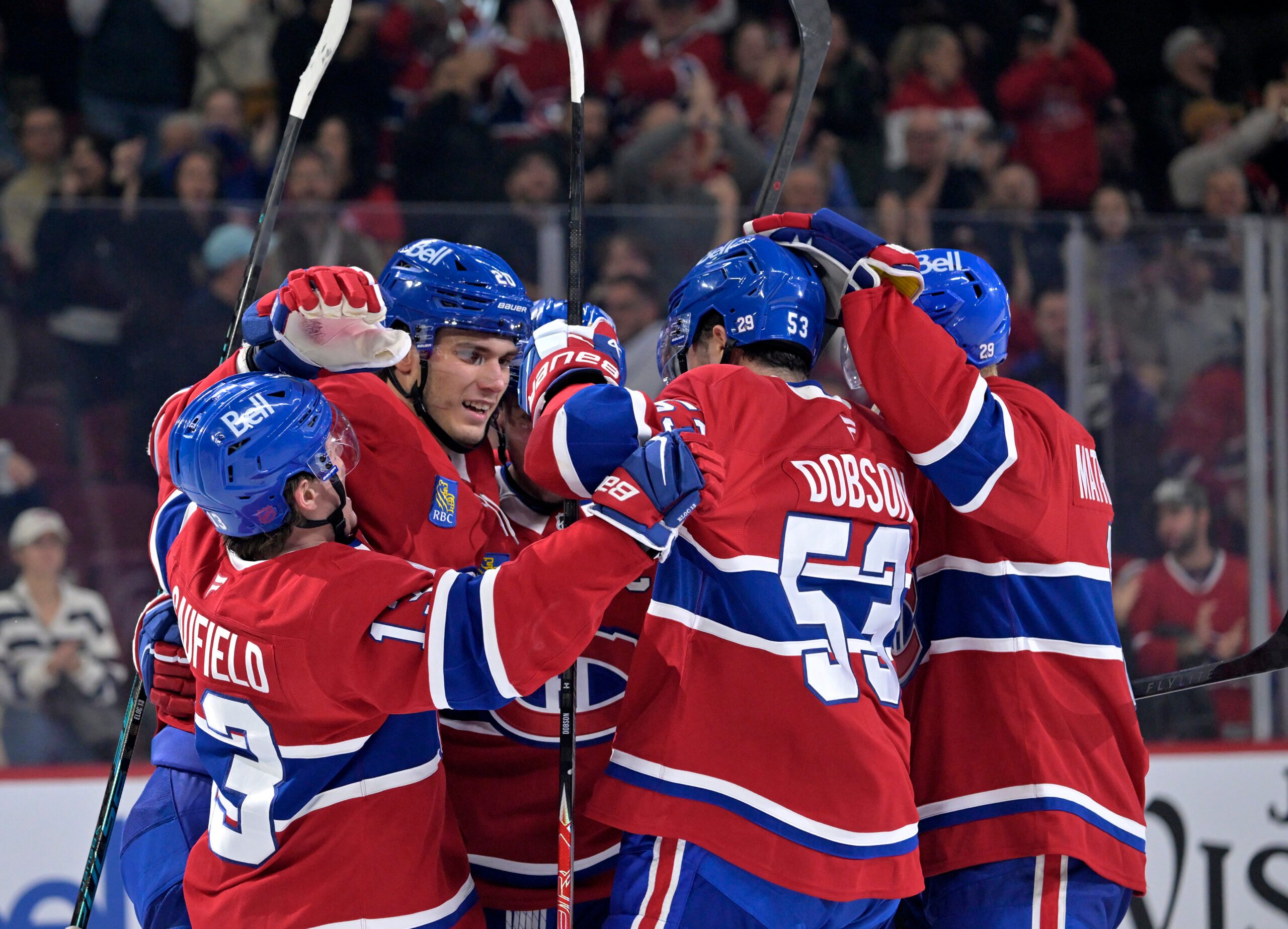 Oct 20, 2025; Montreal, Quebec, CAN; Montreal Canadiens forward Juraj Slafkovsky (20) celebrates with teammates after scoring a goal against the Buffalo Sabres during the third period at the Bell Centre. Mandatory Credit: Eric Bolte-Imagn Images