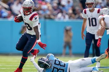 New England Patriots running back Rhamondre Stevenson (38) gets past Tennessee Titans cornerback L'Jarius Sneed (38) during the first quarter at Nissan Stadium in Nashville, Tenn., Sunday, Oct. 19, 2025.
