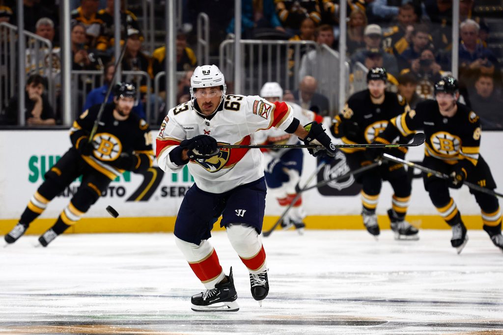 Oct 21, 2025; Boston, Massachusetts, USA; Florida Panthers left wing Brad Marchand (63) chases a loose puck against the Boston Bruins during the third period at TD Garden. Mandatory Credit: Winslow Townson-Imagn Images