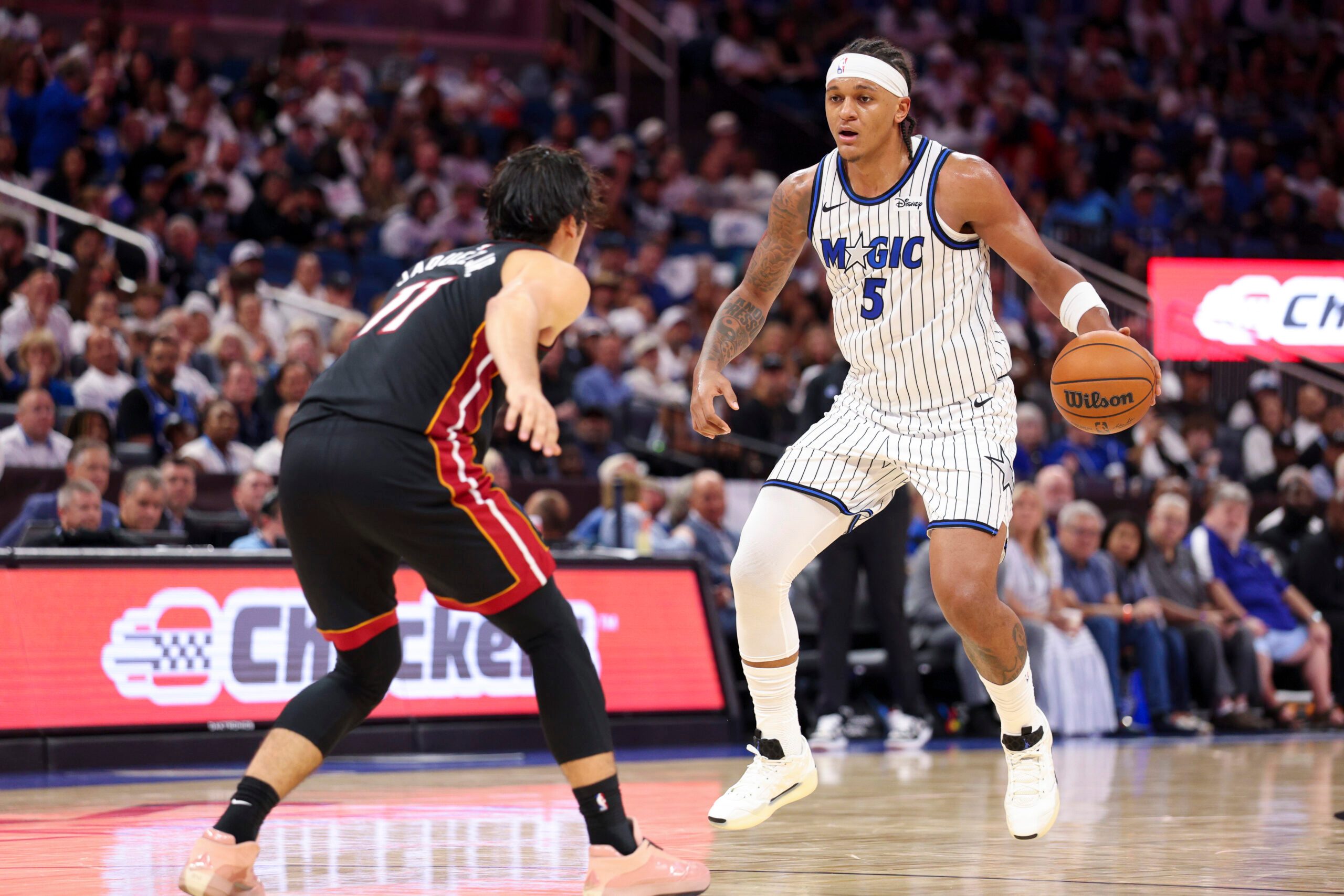 Oct 22, 2025; Orlando, Florida, USA; Orlando Magic forward Paolo Banchero (5) controls the ball against the Miami Heat in the third quarter at Kia Center. Mandatory Credit: Nathan Ray Seebeck-Imagn Images