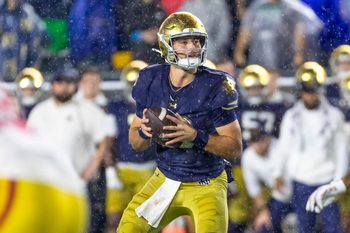 Oct 18, 2025; South Bend, Indiana, USA;  Notre Dame Fighting Irish quarterback CJ Carr (13) looks to pass against the Southern California Trojans during the second half at Notre Dame Stadium. Mandatory Credit: Michael Caterina-Imagn Images