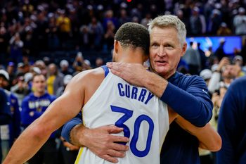 Oct 23, 2025; San Francisco, California, USA; Golden State Warriors guard Stephen Curry (30) embraces head coach Steve Kerr after their overtime win against the Denver Nuggets at Chase Center. Mandatory Credit: Bob Kupbens-Imagn Images