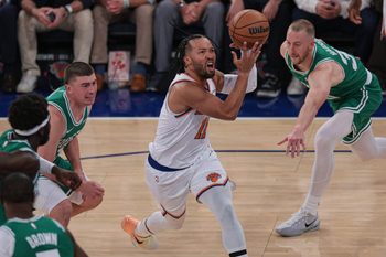 Oct 24, 2025; New York, New York, USA;  New York Knicks guard Jalen Brunson (11) goes to the basket in front of Boston Celtics forward Sam Hauser (30) during the first quarter at Madison Square Garden. Mandatory Credit: Vincent Carchietta-Imagn Images