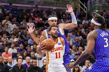 Oct 24, 2025; Orlando, Florida, USA; Atlanta Hawks guard Trae Young (11) is fouled by Orlando Magic guard Anthony Black (0) during the second quarter at Kia Center. Mandatory Credit: Mike Watters-Imagn Images