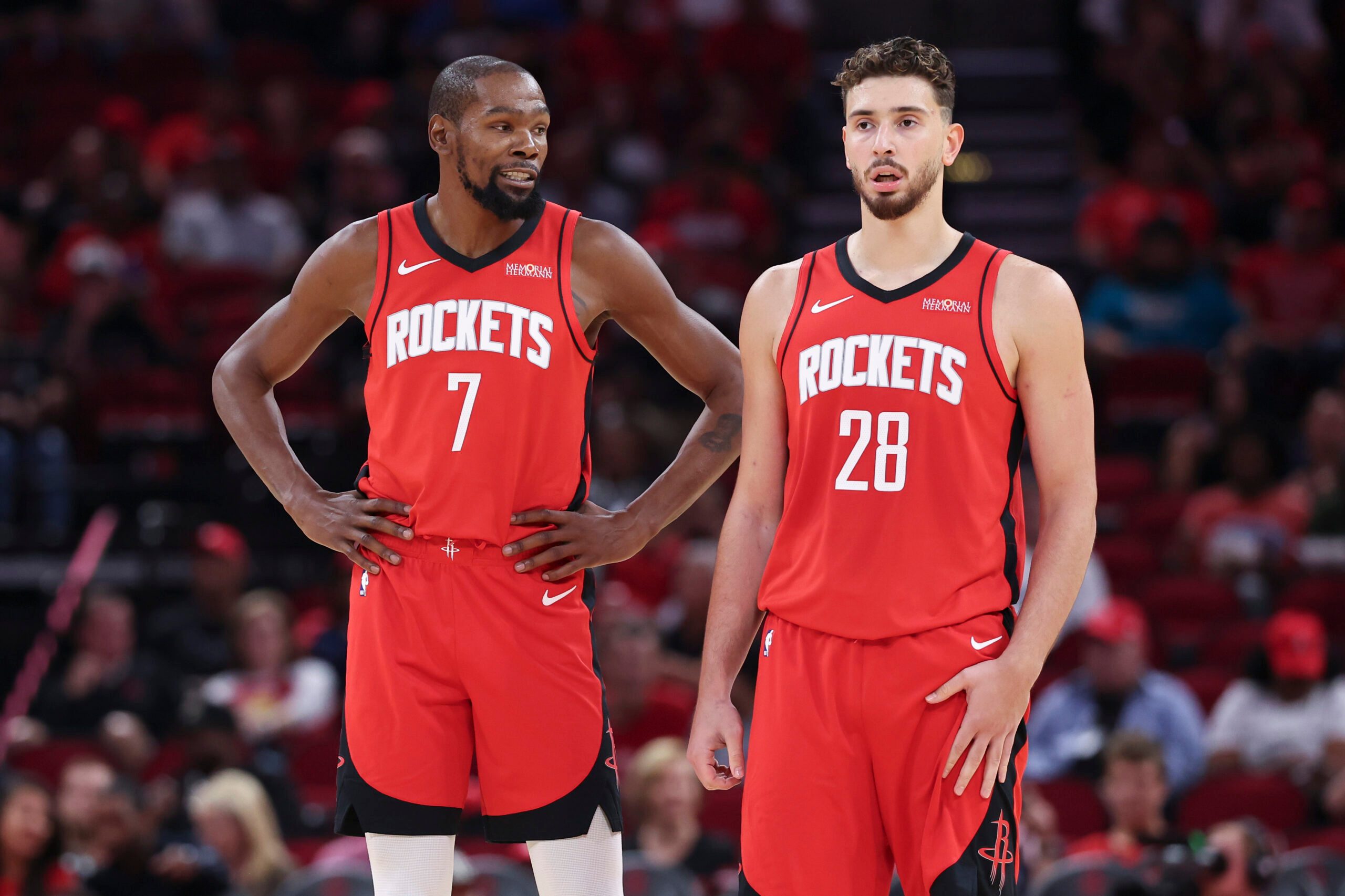 Oct 24, 2025; Houston, Texas, USA; Houston Rockets forward Kevin Durant (7) talks with center Alperen Sengun (28) during the first quarter against the Detroit Pistons at Toyota Center. Mandatory Credit: Troy Taormina-Imagn Images