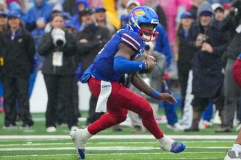 Oct 25, 2025; Lawrence, Kansas, USA; Kansas Jayhawks quarterback Jalon Daniels (6) runs the ball against the Kansas State Wildcats during the second half of the game at David Booth Kansas Memorial Stadium. Mandatory Credit: Denny Medley-Imagn Images