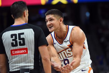Oct 25, 2025; Denver, Colorado, USA; Phoenix Suns guard Grayson Allen (8) questions a call by a referee during the second half against the Denver Nuggets at Ball Arena. Mandatory Credit: Christopher Hanewinckel-Imagn Images
