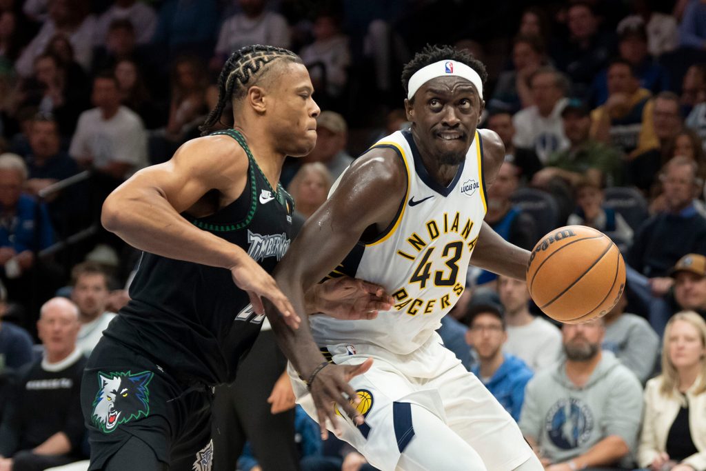 Oct 26, 2025; Minneapolis, Minnesota, USA; Indiana Pacers forward Pascal Siakam (43) dribbles the ball past Minnesota Timberwolves guard Jaylen Clark (22) in the second half at Target Center. Mandatory Credit: Jesse Johnson-Imagn Images