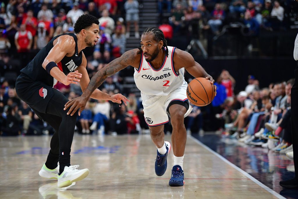 Oct 26, 2025; Inglewood, California, USA; Los Angeles Clippers forward Kawhi Leonard (2) moves the ball against Portland Trail Blazers forward Toumani Camara (33) during the first half at Intuit Dome. Mandatory Credit: Gary A. Vasquez-Imagn Images