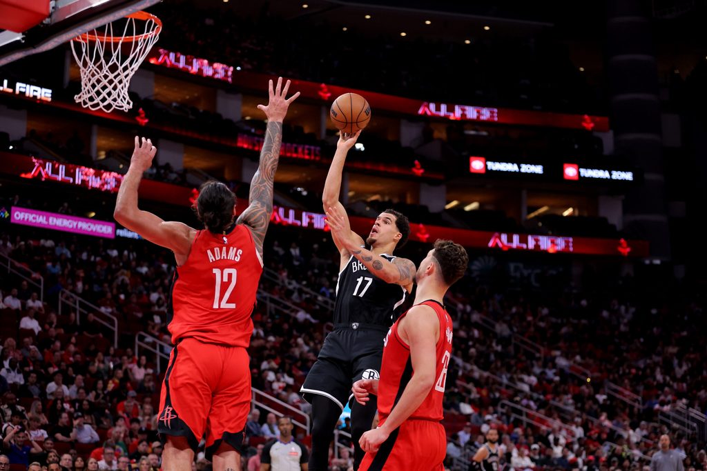 Oct 27, 2025; Houston, Texas, USA; Brooklyn Nets forward Michael Porter Jr. (17) shoots inside against Houston Rockets forward Tari Eason (17) during the third quarter at Toyota Center. Mandatory Credit: Erik Williams-Imagn Images