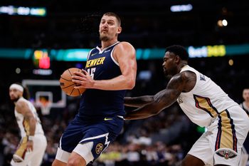 Oct 29, 2025; Denver, Colorado, USA; Denver Nuggets center Nikola Jokic (15) controls the ball under pressure form New Orleans Pelicans forward Zion Williamson (1) in the third quarter at Ball Arena. Mandatory Credit: Isaiah J. Downing-Imagn Images