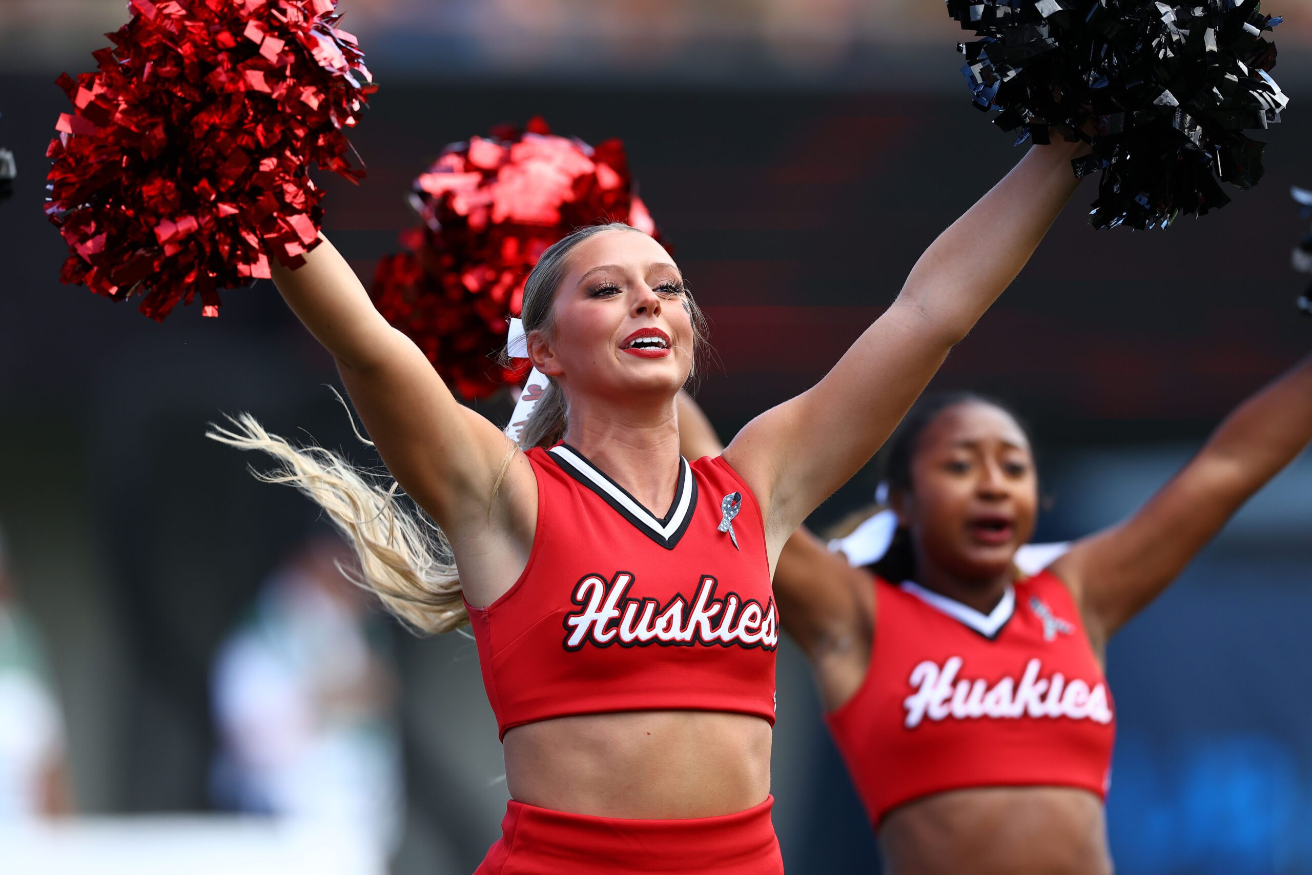 Sep 21, 2024; DeKalb, Illinois, USA; Northern Illinois Huskies cheerleaders perform during a timeout during the first half at Huskie Stadium. Mandatory Credit: Mike Dinovo-Imagn Images