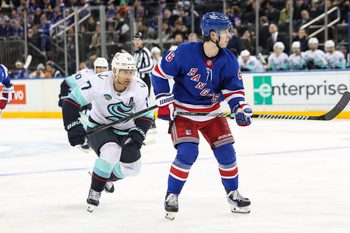 Dec 8, 2024; New York, New York, USA; Seattle Kraken left wing Jaden Schwartz (17) chases after New York Rangers defenseman Zac Jones (6) during the third period at Madison Square Garden. Mandatory Credit: Danny Wild-Imagn Images