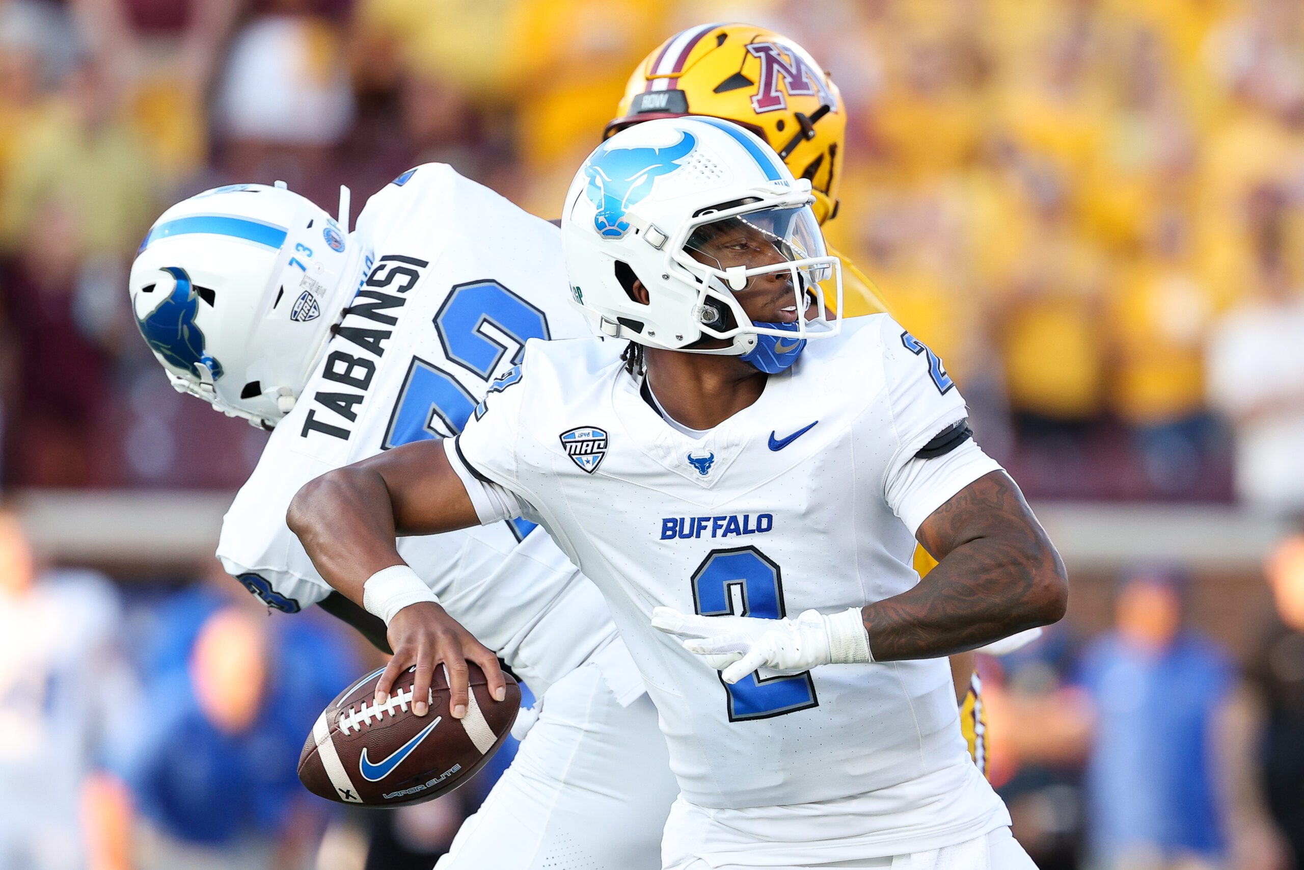 Aug 28, 2025; Minneapolis, Minnesota, USA; Buffalo Bulls quarterback Ta'Quan Roberson (2) looks to throw against the Minnesota Golden Gophers during the first half of the game at Huntington Bank Stadium. Mandatory Credit: Matt Krohn-Imagn Images