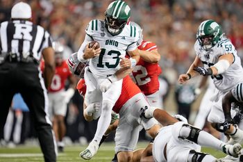 Ohio State Buckeyes defensive lineman Beau Atkinson (14) sacks Ohio Bobcats quarterback Parker Navarro (13) during the second half of the NCAA football game at Ohio Stadium on Sept. 13, 2025. Ohio State won 37-9.