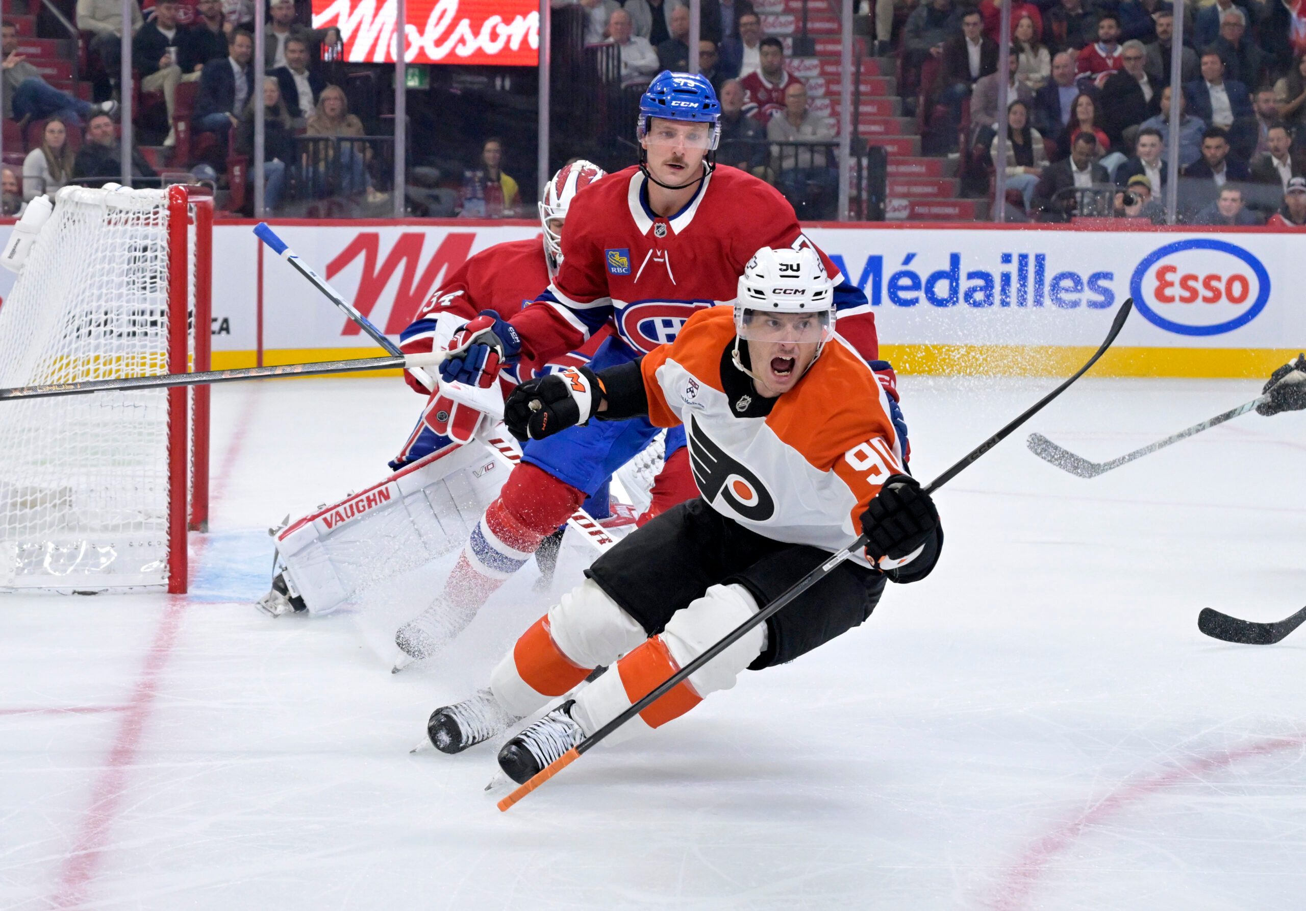 Sep 23, 2025; Montreal, Quebec, CAN; Philadelphia Flyers forward Anthony Richard (90) scores a goal against Montreal Canadiens goalie Kaapo Kahkonen (34) during the second period at the Bell Centre. Mandatory Credit: Eric Bolte-Imagn Images