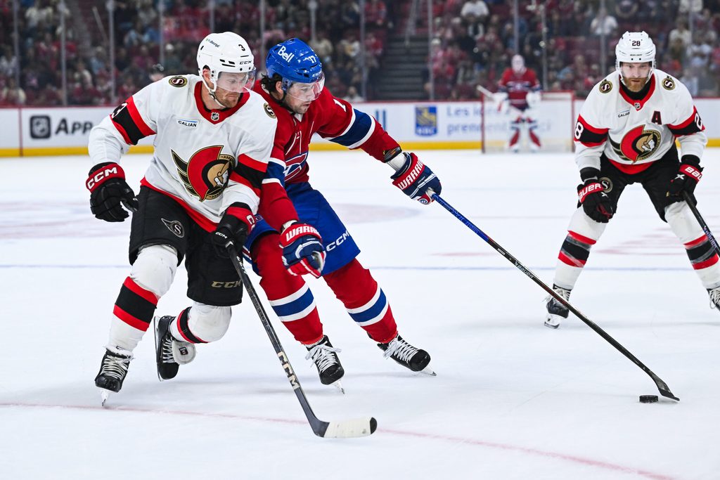 Oct 4, 2025; Montreal, Quebec, CAN; Montreal Canadiens right wing Josh Anderson (17) plays the puck against Ottawa Senators defenseman Nick Jensen (3) during the third period at Bell Centre. Mandatory Credit: David Kirouac-Imagn Images