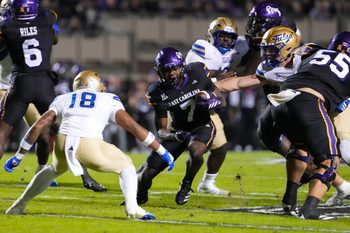 Oct 16, 2025; Greenville, North Carolina, USA; East Carolina Pirates running back London Montgomery (7) runs with the ball against the Tulsa Golden Hurricane during the first half at Dowdy-Ficklen Stadium. Mandatory Credit: James Guillory-Imagn Images