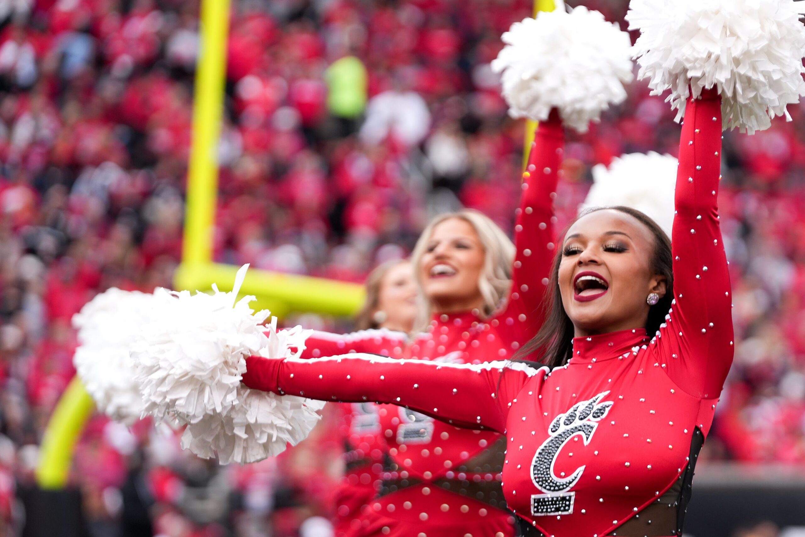 Cincinnati Bearcats cheerleaders perform a routine during a NCAA men’s football game between the Cincinnati Bearcats and Baylor Bears, Saturday, Oct. 25, 2025, at Nippert Stadium in Cincinnati.
