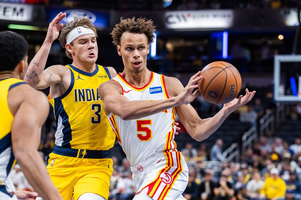 Oct 31, 2025; Indianapolis, Indiana, USA; Atlanta Hawks guard Dyson Daniels (5) passes the ball while Indiana Pacers guard Mac McClung (3) defends in the second half at Gainbridge Fieldhouse. Mandatory Credit: Trevor Ruszkowski-Imagn Images