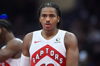 Oct 31, 2025; Cleveland, Ohio, USA; Toronto Raptors forward Collin Murray-Boyles (12) walks on the court in the third quarter against the Cleveland Cavaliers at Rocket Arena. Mandatory Credit: David Richard-Imagn Images