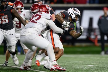 Nov 1, 2025; Corvallis, Oregon, USA; Washington State Cougars defensive lineman Darrion Dalton (92) tackles Oregon State Beavers running back Anthony Hankerson (0)  during the fourth quarter at Reser Stadium. Mandatory Credit: Craig Strobeck-Imagn Images