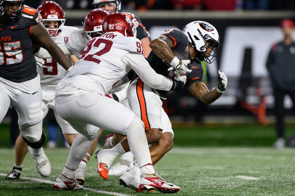 Nov 1, 2025; Corvallis, Oregon, USA; Washington State Cougars defensive lineman Darrion Dalton (92) tackles Oregon State Beavers running back Anthony Hankerson (0) during the fourth quarter at Reser Stadium. Mandatory Credit: Craig Strobeck-Imagn Images