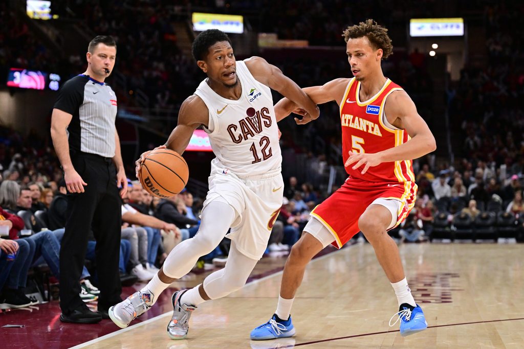 Nov 2, 2025; Cleveland, Ohio, USA; Cleveland Cavaliers forward De'Andre Hunter (12) drives to the basket against Atlanta Hawks guard Dyson Daniels (5) during the second half at Rocket Arena. Mandatory Credit: Ken Blaze-Imagn Images