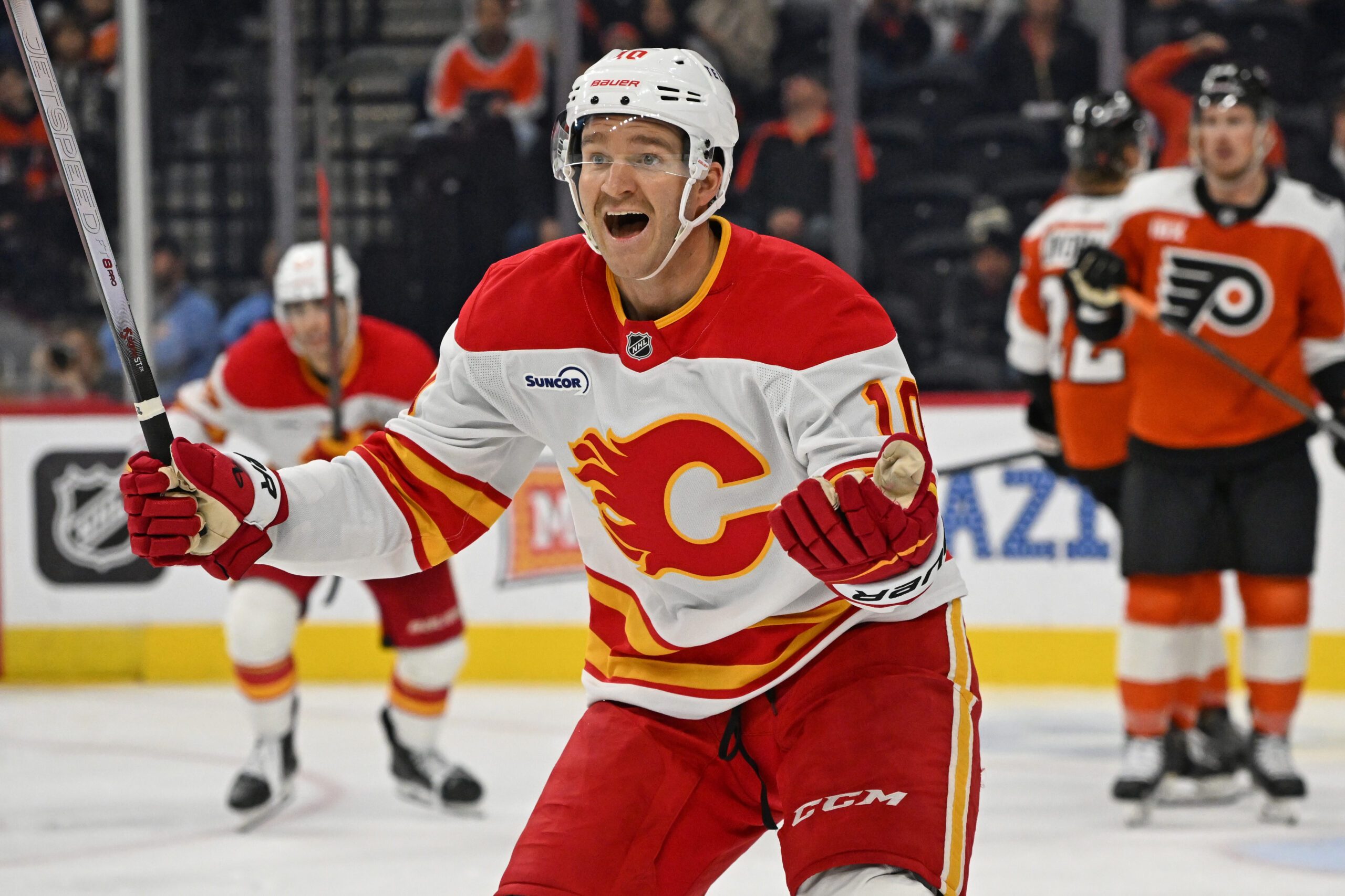Nov 2, 2025; Philadelphia, Pennsylvania, USA; Calgary Flames left wing Jonathan Huberdeau (10) reacts after scoring a goal against the Philadelphia Flyers during the third period at Xfinity Mobile Arena. Mandatory Credit: Eric Hartline-Imagn Images
