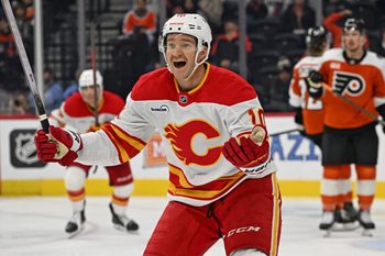 Nov 2, 2025; Philadelphia, Pennsylvania, USA; Calgary Flames left wing Jonathan Huberdeau (10) reacts after scoring a goal against the Philadelphia Flyers during the third period at Xfinity Mobile Arena. Mandatory Credit: Eric Hartline-Imagn Images