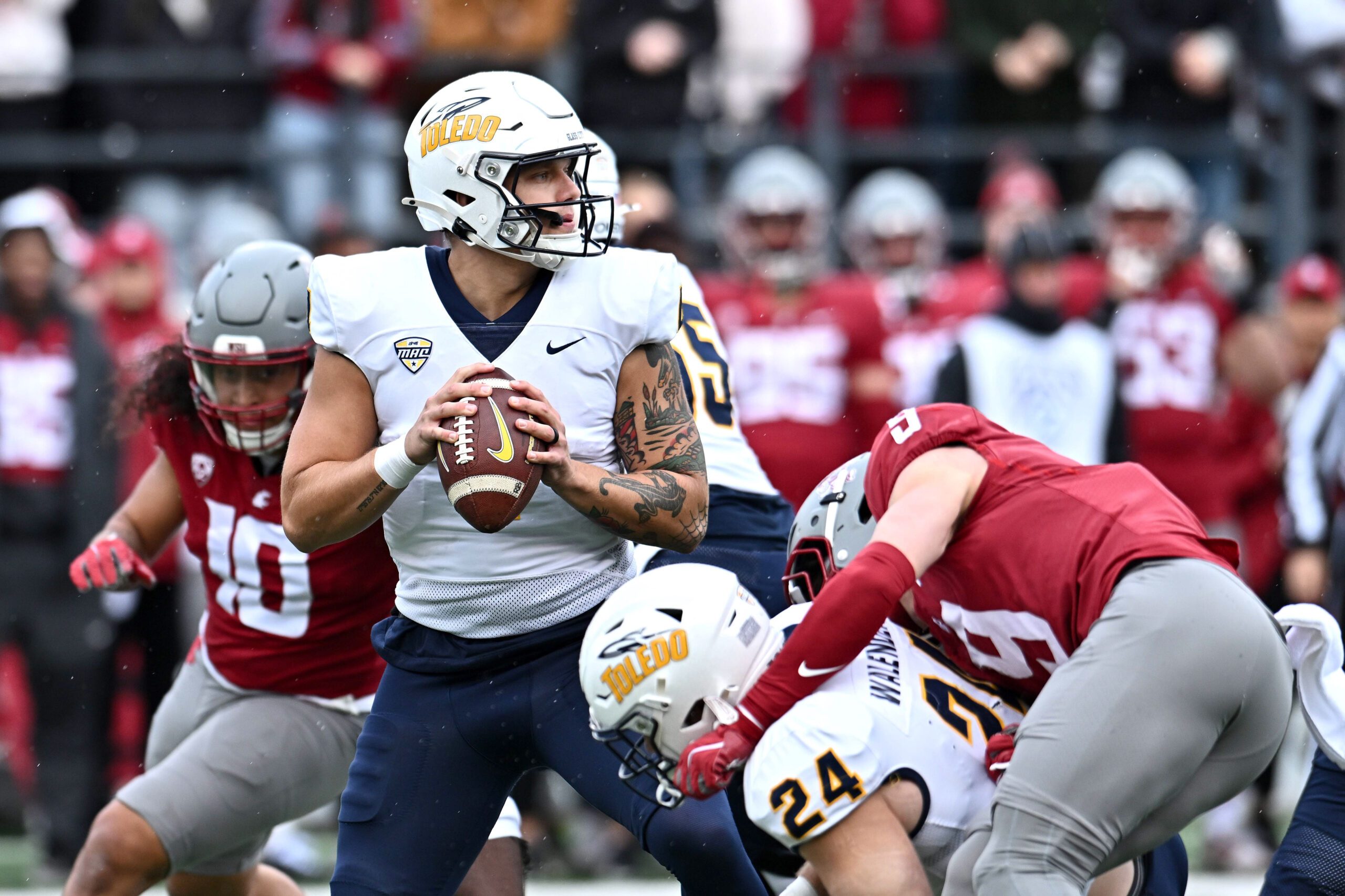 Oct 25, 2025; Pullman, Washington, USA; Toledo Rockets quarterback Tucker Gleason (4) throws a pass against the Washington State Cougars in the first half at Gesa Field at Martin Stadium. Mandatory Credit: James Snook-Imagn Images