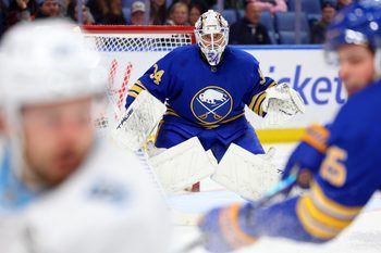 Nov 4, 2025; Buffalo, New York, USA;  Buffalo Sabres goaltender Alex Lyon (34) looks for the puck during the third period against the Utah Mammoth at KeyBank Center. Mandatory Credit: Timothy T. Ludwig-Imagn Images