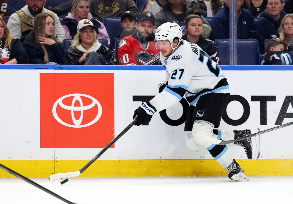 Nov 4, 2025; Buffalo, New York, USA; Utah Mammoth center Barrett Hayton (27) skates up ice with the puck during the third period against the Buffalo Sabres at KeyBank Center. Mandatory Credit: Timothy T. Ludwig-Imagn Images