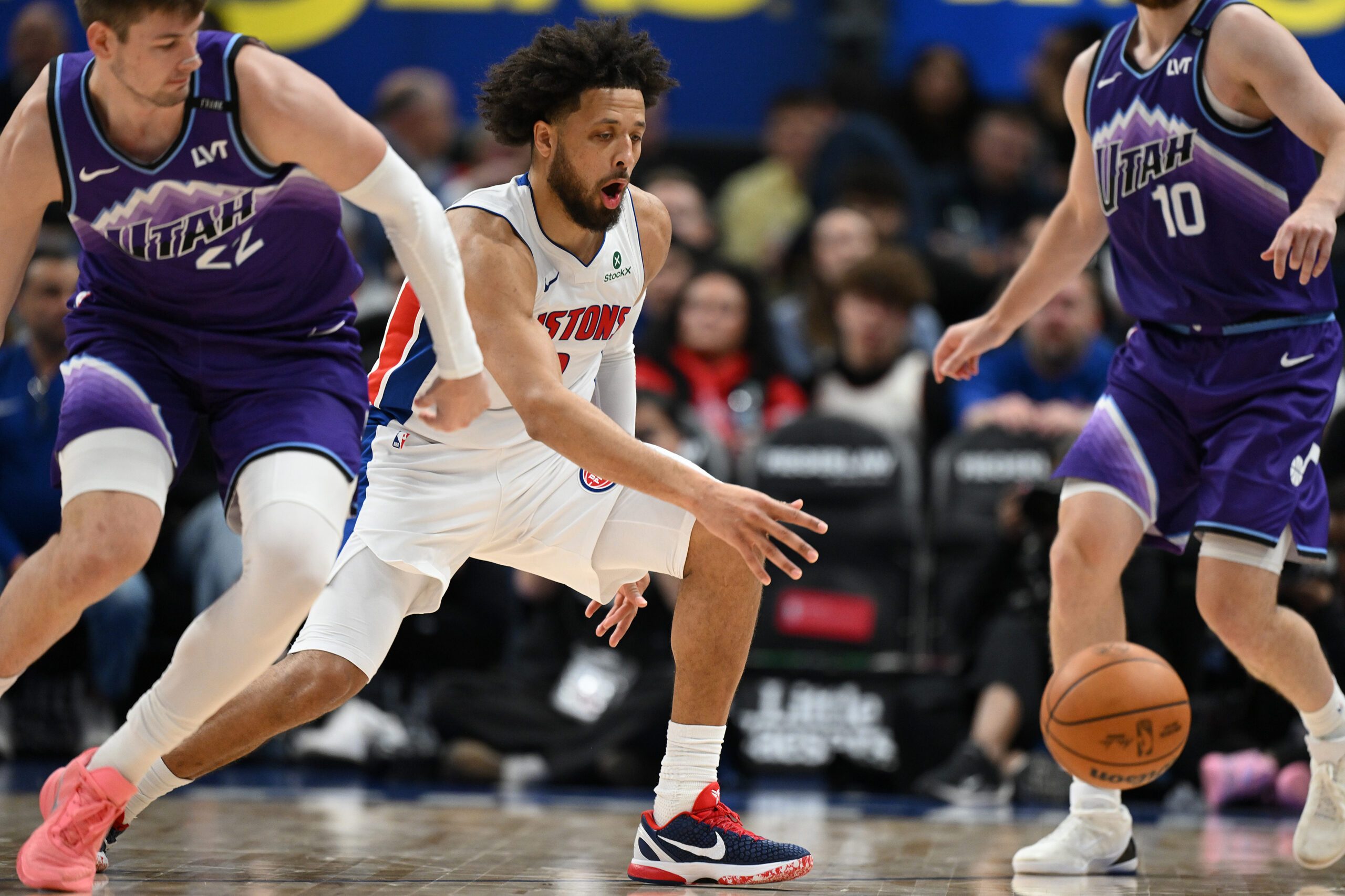 Nov 5, 2025; Detroit, Michigan, USA; Detroit Pistons guard Cade Cunningham (2) steals the ball from Utah Jazz forward Kyle Filipowski (22)  in the fourth quarter at Little Caesars Arena. Mandatory Credit: Lon Horwedel-Imagn Images