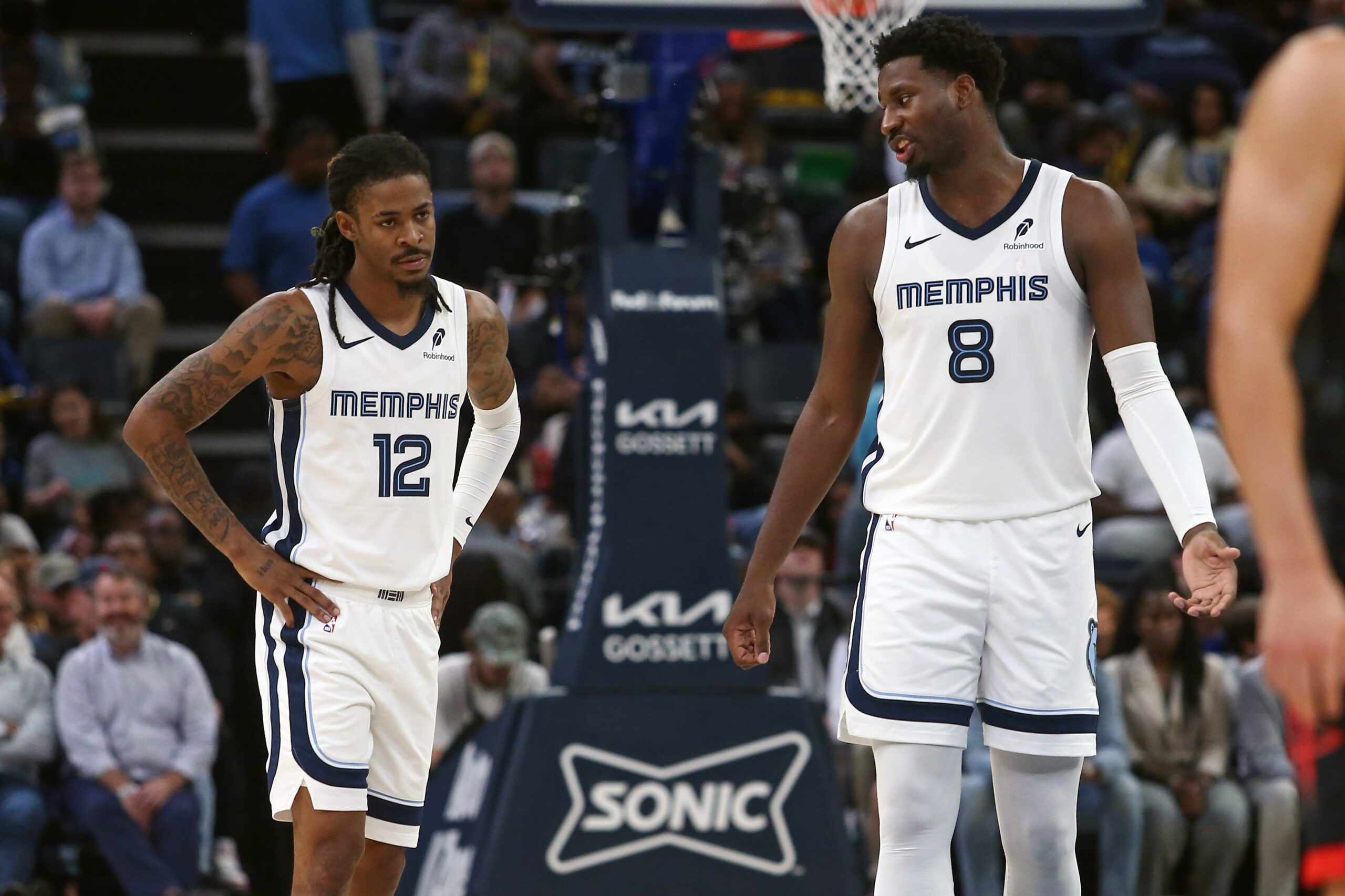 Nov 5, 2025; Memphis, Tennessee, USA; Memphis Grizzlies forward/center Jaren Jackson Jr. (8) talks with guard Ja Morant (12) during the second quarter against the Houston Rockets at FedExForum. Mandatory Credit: Petre Thomas-Imagn Images